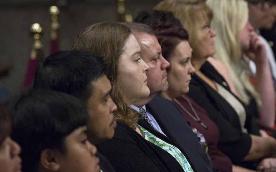 Relatives of sailors killed in collisions involving the USS John S. McCain and the USS Fitzgerald listen to testimony during a Senate Armed Services Committee hearing on Capitol Hill, Sept. 19, 2017.