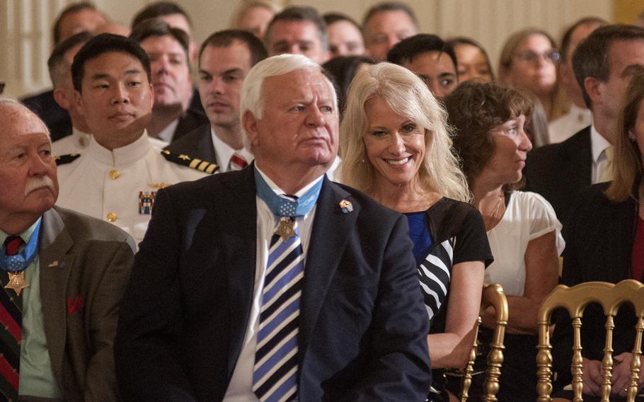 Counselor to the President Kellyanne Conway sits behind Medal of Honor recipients Michael Thornton and Barney Barnum, at left, prior to the start of a Medal of Honor ceremony at the White House in Washington, D.C., on Thursday, May 24, 2018.