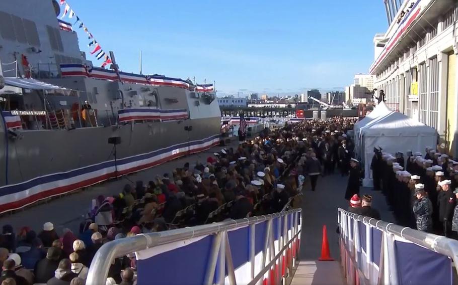 A video screen grab shows the commissioning ceremony of the U.S. Navy's newest guided-missile destroyer, the USS Thomas Hudner (DDG 116) in Boston on Saturday, Dec. 1, 2018.