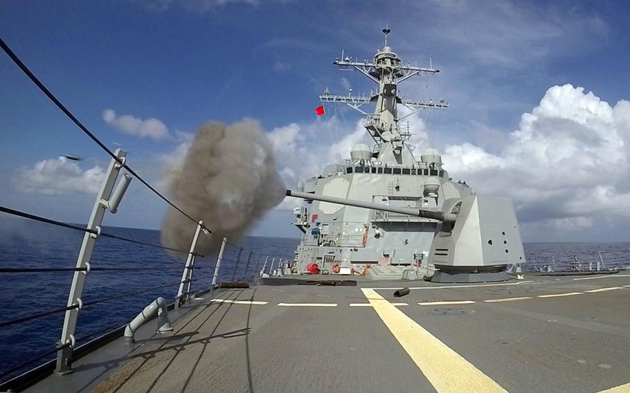 The guided-missile destroyer USS Spruance fires its 5-inch gun during a drill in the Pacific Ocean, Nov. 22, 2018.