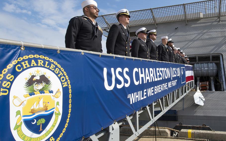The crew of the Navy's newest littoral combat ship, USS Charleston (LCS 18), mans the rails and brings the ship to life during the ship's commissioning ceremony in Charleston, S.C., on Saturday, March 2, 2019.