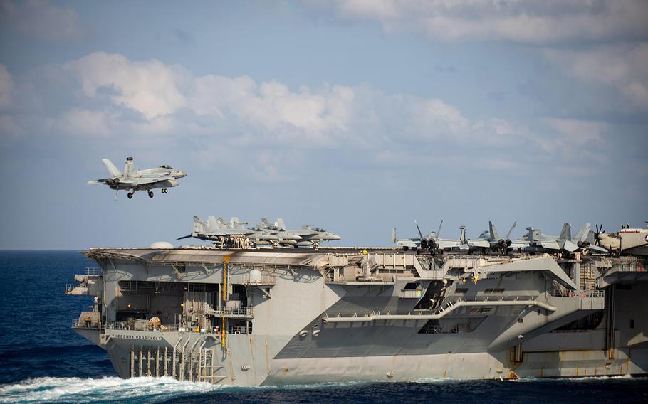 An F/A 18F Super Hornet lands on the flight deck of the USS Theodore Roosevelt (CVN 71) March 18, 2020, while the aircraft carrier was transiting the Philippine Sea.