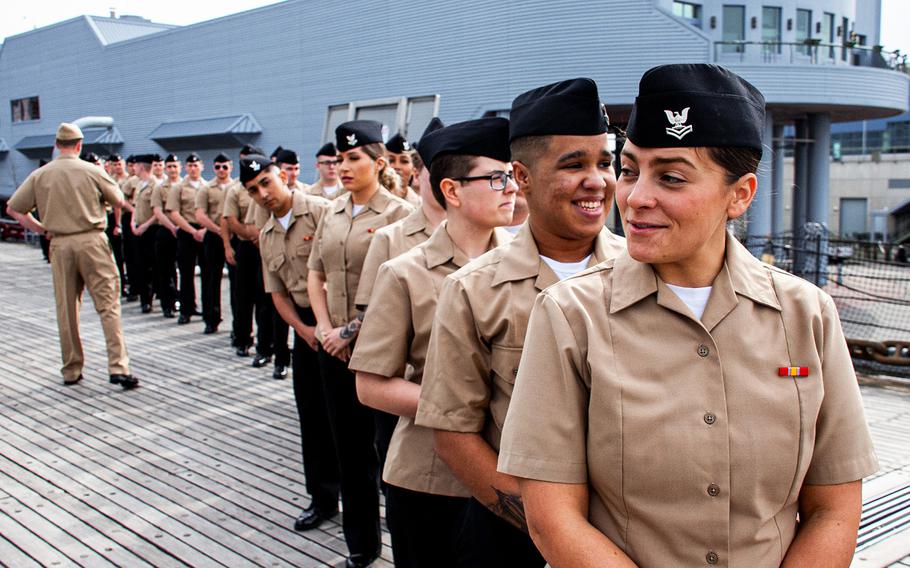 Sailors stand in formation onboard the USS Wisconsin (BB-64) prior to their group reenlistment on Jan. 30, 2020.