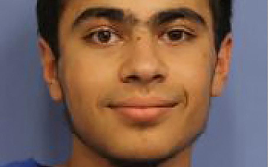This undated handout photo provided by Del Mar College, Texas, shows Adam Alsahli's image for his student identification card.