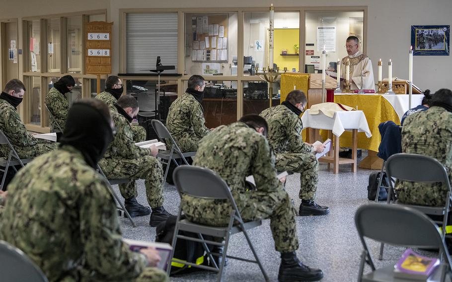 Recruits attend Catholic worship service inside the Recruit Memorial Chapel at U.S. Navy Recruit Training Command in April 2020.
