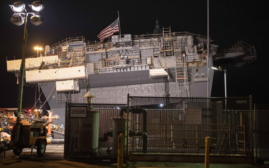 Damage control efforts continue on board the amphibious assault ship USS Bonhomme Richard on Thursday, July 16, 2020. Crews were cleared from the ship and the pier at Naval Base San Diego, Calif., “due to an initial shift in the ship’s list.”