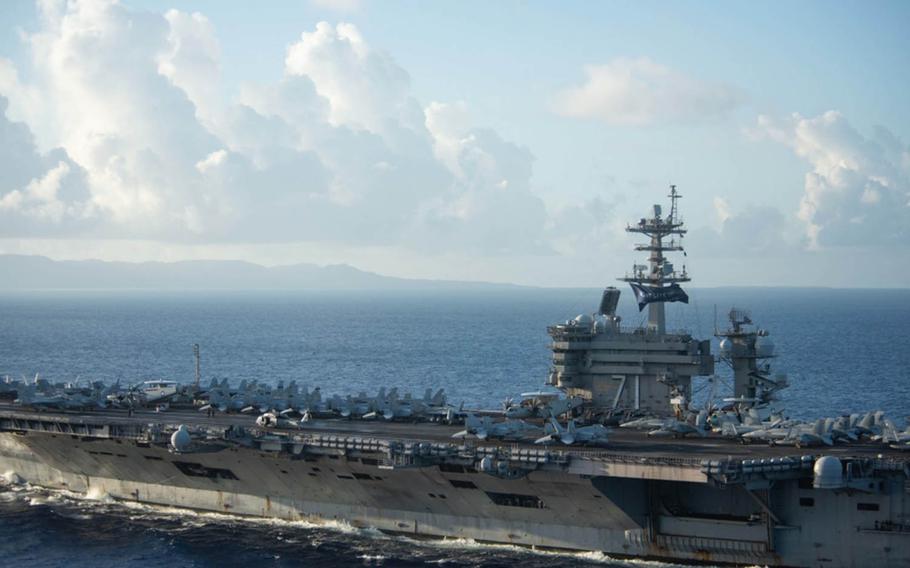 The aircraft carrier USS Theodore Roosevelt approaches Apra Harbor, Guam, June 3, 2020. 