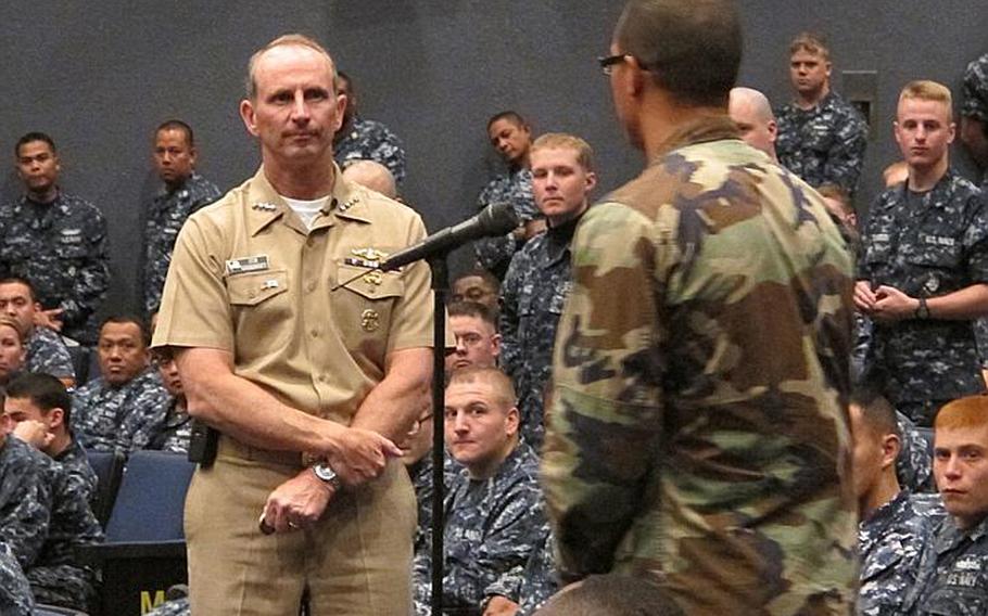 Chief of Naval Operations Adm. Jonathan Greenert listens to a question from a sailor during an all-hands meeting at the Yokosuka Naval Base fleet theater Oct. 3, 2011. Greenert, who began his tenure last month as the top officer last month of the Navy, faces the difficult task of preserving readiness at a time when lawmakers are calling for significant budget cuts.