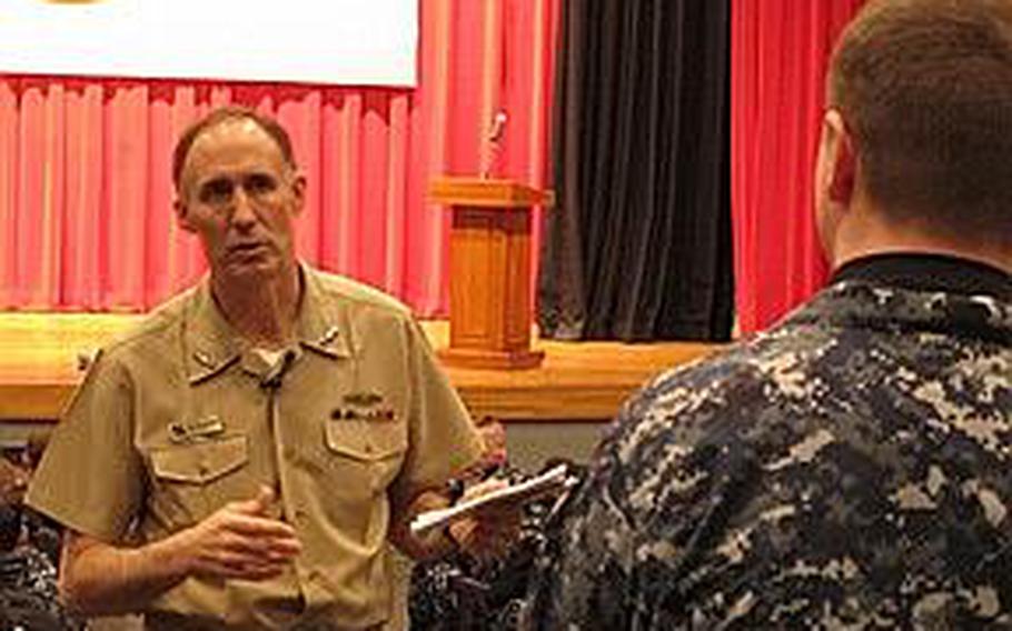 Vice Adm. Scott Van Buskirk, chief of naval personnel, answers a question from a sailor during an all-hands forum Feb. 23, 2012, at Yokosuka Naval Base. Van Buskirk said that he did not foresee convening another enlisted retention board, which this year will cut about 3,000 sailors from the ranks, through at least fiscal year 2014.