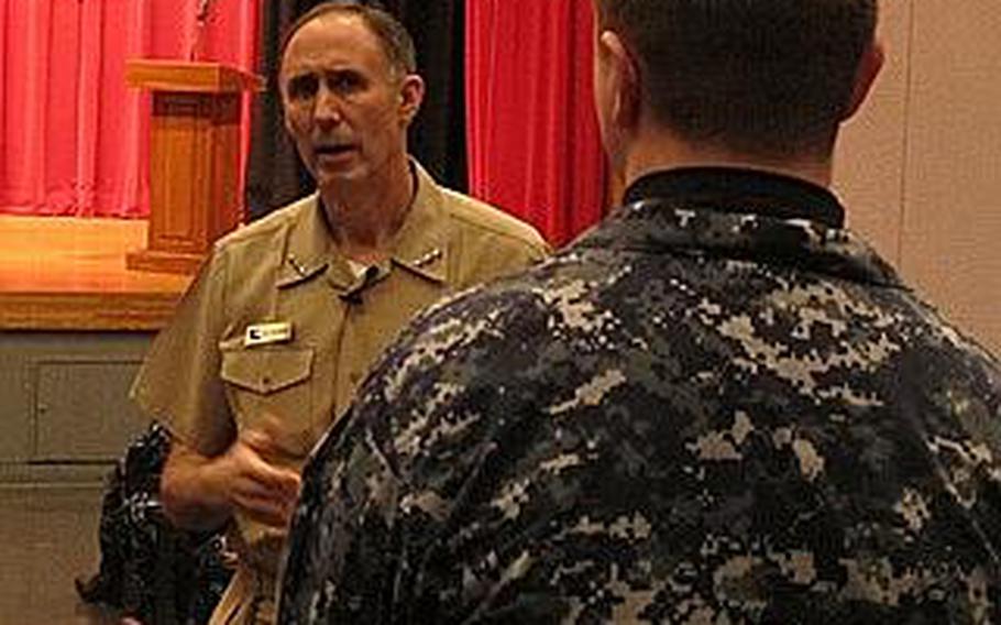 Vice Adm. Scott Van Buskirk, chief of naval personnel, answers a question from a sailor during an all-hands forum Feb. 23, 2012, at Yokosuka Naval Base. Van Buskirk said that he did not foresee convening another enlisted retention board, which this year will cut about 3,000 sailors from the ranks, through at least fiscal year 2014.