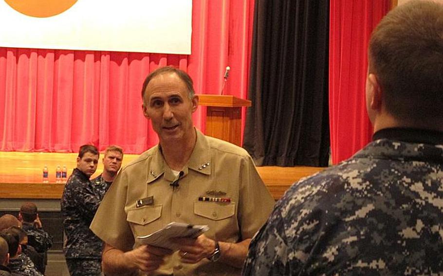 Vice Adm. Scott Van Buskirk, chief of naval personnel, answers a question from a sailor during an all-hands forum Feb. 23, 2012, at Yokosuka Naval Base. Van Buskirk said that he did not foresee convening another enlisted retention board, which this year will cut about 3,000 sailors from the ranks, through at least fiscal year 2014.