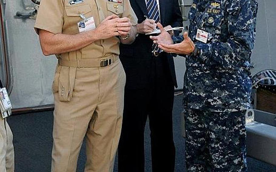 Chief of Naval Operations Adm. Jonathan Greenert, left, speaks with Cmdr. Jon Haydel, former commanding officer of the Pre-Commissioning Unit San Diego during a tour of the ship in October at the Huntington Ingalls Shipyard in Pascagoula, Miss. Haydel was relieved of duty Monday while allegations of personal misconduct are investigated.