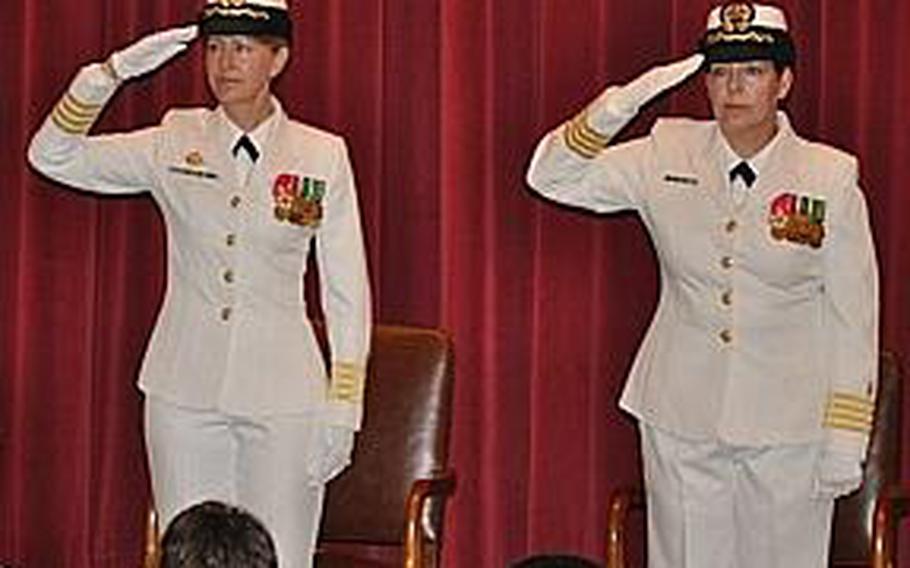 Capt. Marcia Lyons, right, takes command of Naval Health Clinic New England from Rear Adm. Elaine Wagner during a 2010 ceremony. Wagner relieved Lyons on April 6, 2012, after problems were identified in an annual command climate survey.