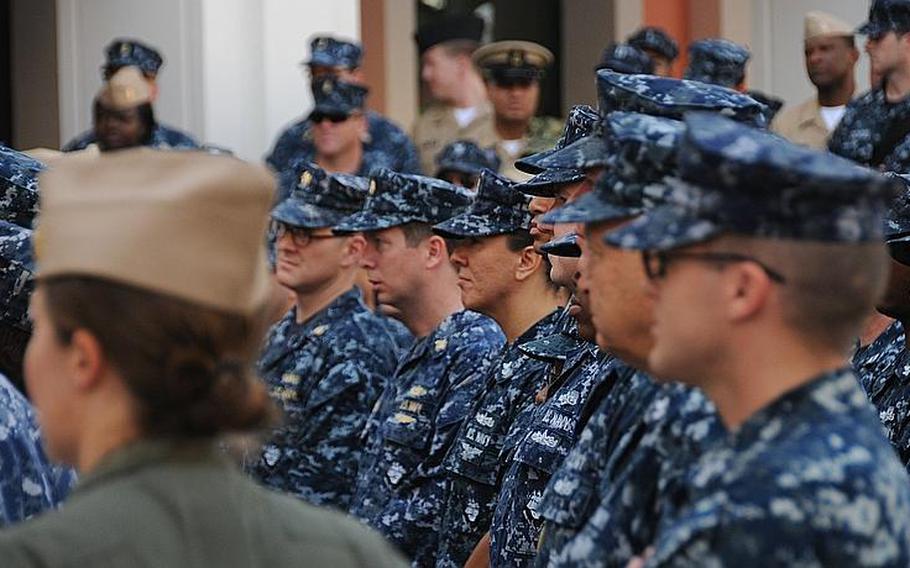 Officers and enlisted sailors listen early Thursday morning to Vice Adm. Scott Van Buskirk, chief of naval personnel, who discussed issues such as manning, job performance, education and training, and deployments. He addressed sailors and civilians during a visit to Naples, Italy.