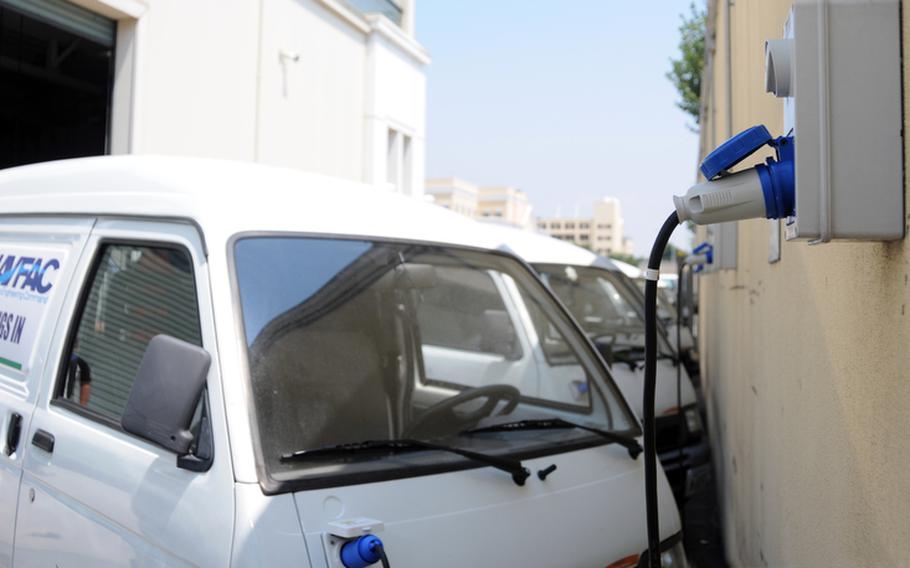 Some of the Micro-Vett Edyone electric vehicles assigned to Naval Support Activity Naples, Italy, are plugged in to charge outside of the public works department at the Capodichino Navy base.