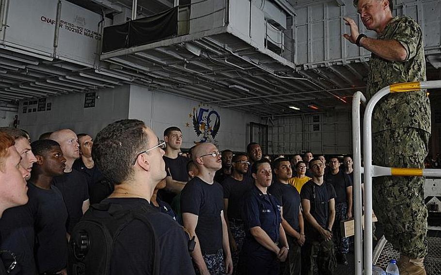 Vice Chief of Naval Operations  Adm. Mark Ferguson speaks with sailors in the hangar bay of aircraft carrier USS Enterprise on Tuesday. Ferguson is visiting deployed sailors and leadership in the U.S. Central Command area of operations to thank Navy personnel and demonstrate the continued commitment to regional partners and allies.