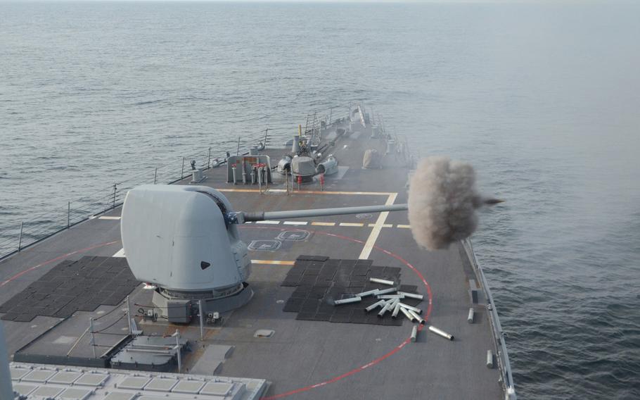 The USS Curtis Wilbur fires its Mark 45 5-inch gun on April 16, 2013, while at sea, east of Japan, during preparations for a Navy Board of Inspection and Survey review. The destroyer is 1 of the Navy's ballistic missile defense-capable ships based in Japan and could be among the 1st to know if North Korea were to launch a ballistic missile.