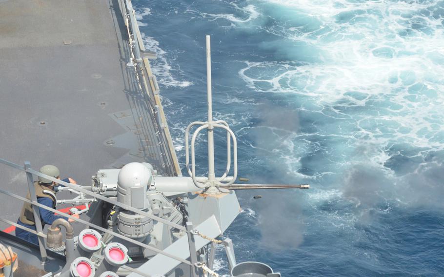 A sailor from the destroyer USS Curtis Wilbur fires one of the ship's two 25mm guns on April 16, 2013, while at sea, east of Japan, during preparations for an upcoming Navy Board of Inspection and Survey review. The gun can be fired manually or through automated controls. The destroyer is one of the Navy's ballistic missile defense-capable ships based in Japan, and could be among the first to know if North Korea were to launch a ballistic missile.