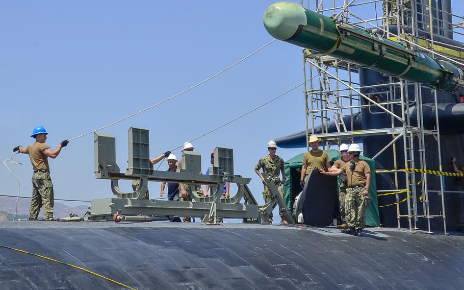 Submariners handle a Mark 46 torpedo aboard the USS Olympia on July 11, 2019. The Navy announced on Sept. 30, 2019, that the torpedoman's mate rating has been re-established after 24 years.