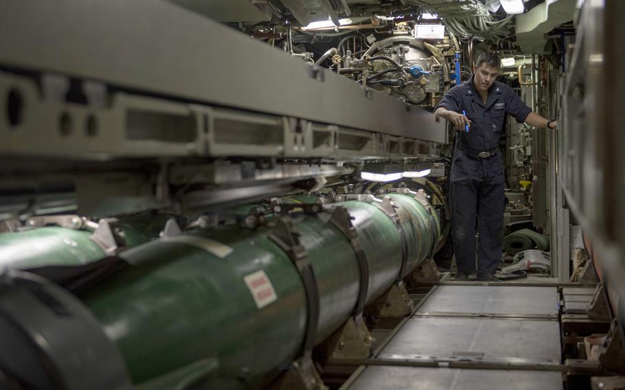 Petty Officer 3rd Class Raul Bonilla, a machinist's mate (weapons) who will transition to a torpedoman's mate starting Oct. 1, 2019, loads a Mark 48 torpedo on the USS Olympia on July 12, 2018. The Navy announced on Sept. 30, 2019, that the torpedoman's mate rating has been re-established, 24 years after it was merged with the machinist's mate (weapons) rating.