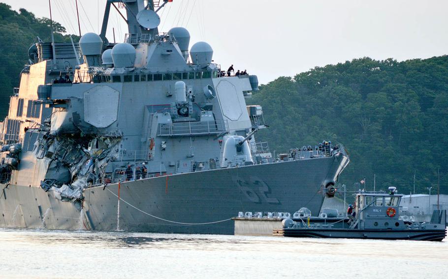 The guided-missile destroyer USS Fitzgerald returns to Yokosuka Naval Base, Japan, following a collision with a merchant vessel on June 17, 2017. 