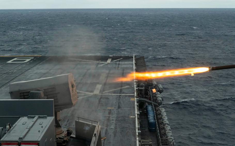 The amphibious assault ship USS America fires a RIM-116 rolling airframe missile while underway in the Philippine Sea, Tuesday, Jan. 24, 2023. 