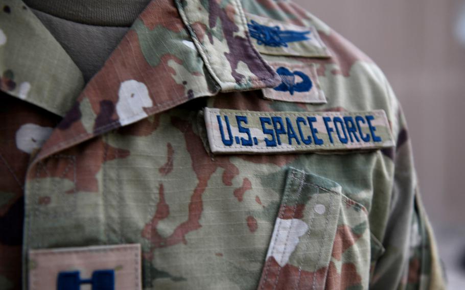 Capt. Ryan Vickers stands for a photo to display his new service tapes after taking his oath of office to transfer from the U.S. Air Force to the U.S. Space Force on Sept. 1, 2020, at Al Udeid Air Base, Qatar. 