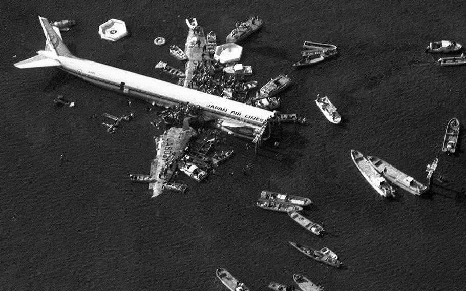 Boats surround a Japan Air Lines DC-8 that crashed in a shallow part of Tokyo Bay while landing at Haneda International Airport in February, 1982, killing 24 of the 166 passengers and crew on board as the fuselage split in two.