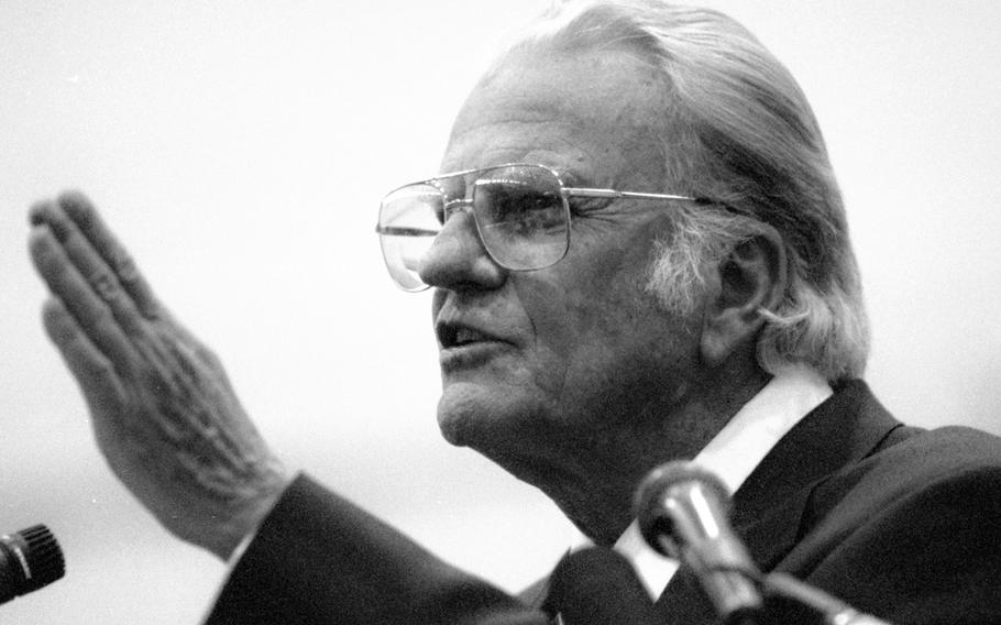 Evangelist Billy Graham conducts a Sunday service at Yokota Air Base in January, 1994.