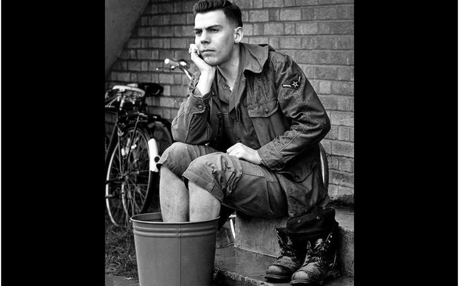 RAF Croughton, England, April, 1966: Airman 3rd Class William W. Spurlock soaks his feet after one of his long hikes.