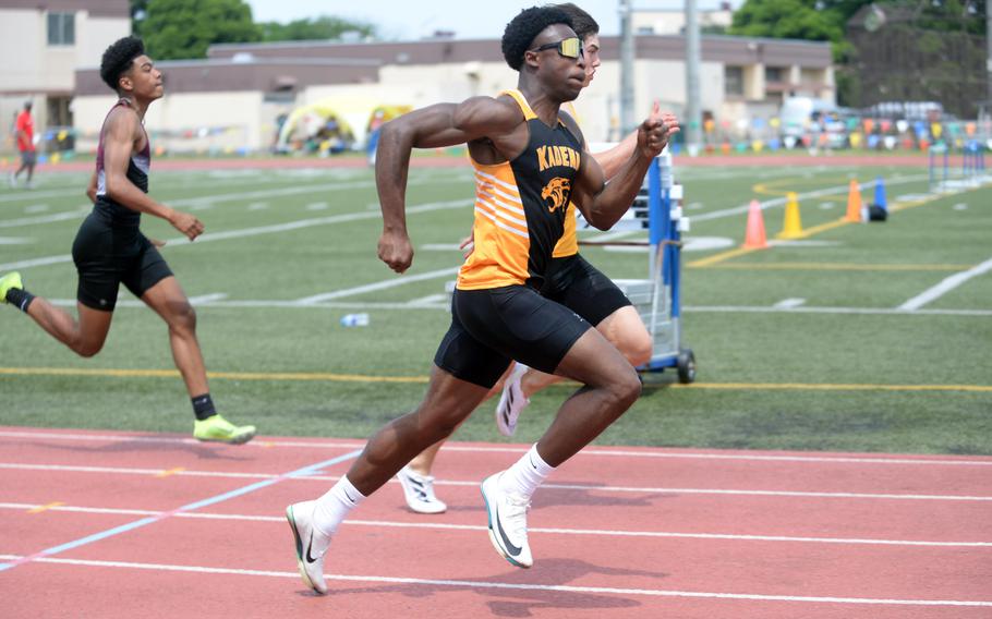 Kadena senior Neil Kentish, the unofficial "Pacific's fastest human," outlasts ASIJ's Oisin Kaiya to the finish of the 100.