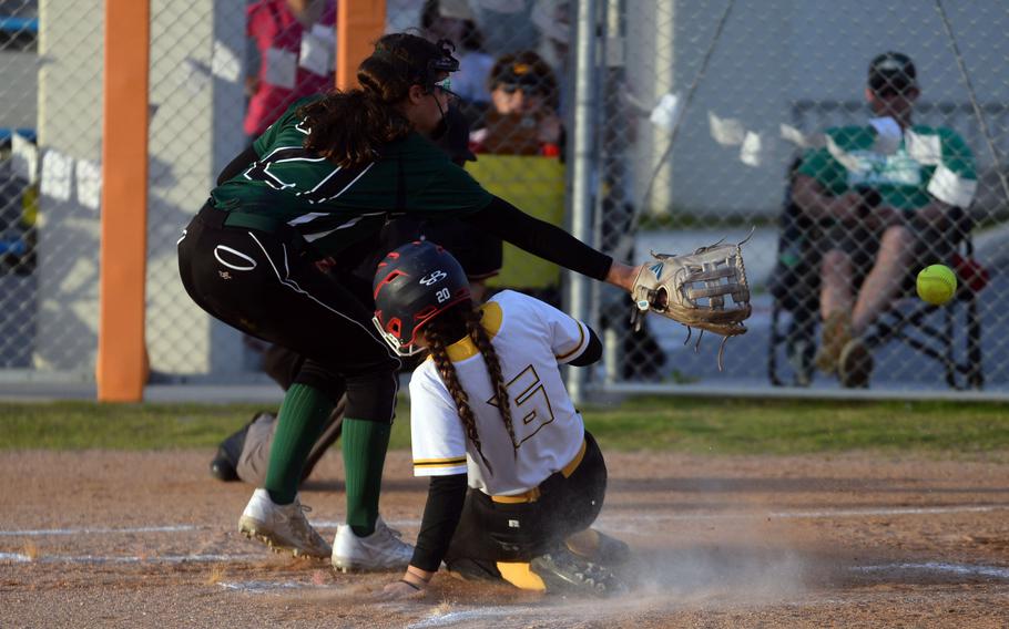 Nao Grove slides into home.