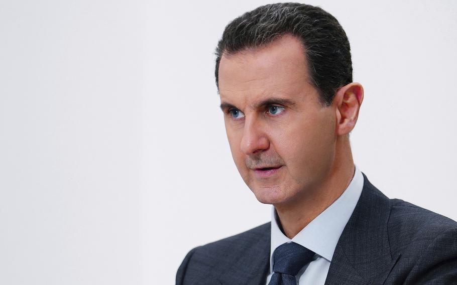 In this photo released on Nov. 9, 2019 by the Syrian official news agency SANA, Syrian President Bashar Assad speaks in Damascus, Syria. Syria’s embattled President Bashar Assad has received late Monday, May 15, 2023 an invitation to attend the upcoming COP28 climate talks in Dubai later this year, even as the yearslong war in his country over his rule grinds on. 