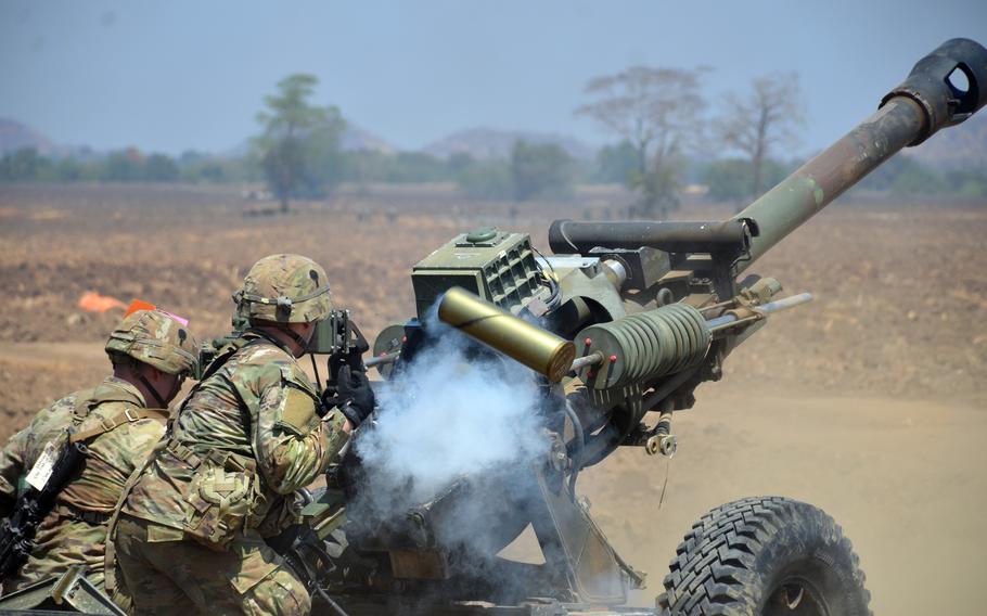 Paratroopers fire an M119A3 howitzer after a Cobra Gold jump in central Thailand, March 5, 2024. 