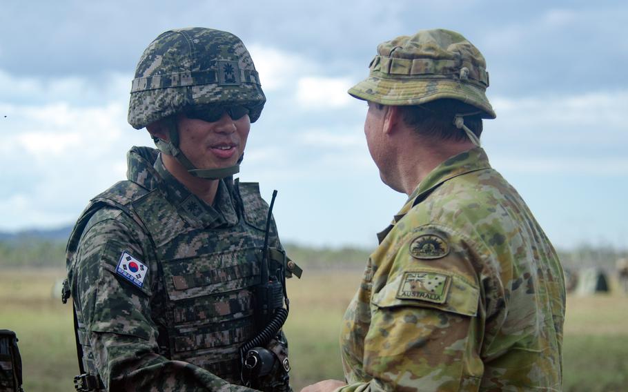 A South Korean soldier speaks with Australian Brig. Gen. Nicholas Foxall during a live-fire Talisman Sabre drill at Shoalwater Bay Training Area in Queensland, Australia, Saturday, July 22, 2023.