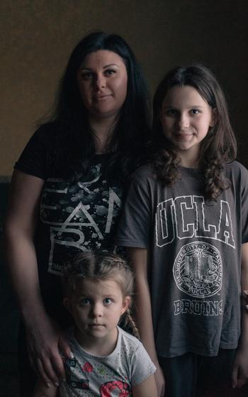 Diana Shapovalova, 34, with her daughters, Kira, 12, and Milana, 4. Shapovalova, a gynecologist, is based in the small town of Shevchenkove, and her patients often travel long and dangerous routes to see her.