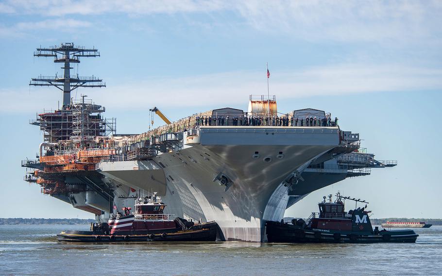 The Nimitz-class aircraft carrier USS John C. Stennis (CVN 74) is moved to an outfitting berth in Newport News, Virginia, on April 8, 2024. 