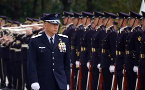Gen. Kenichiro Nagumo, the first commander of Japan's Joint Operations Command, reviews troops ahead of the activation ceremony at Camp Ichigaya in central Tokyo, March 24, 2025.
