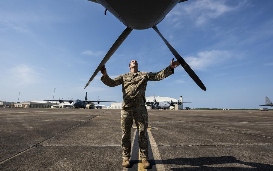An airman checks on an aircraft.