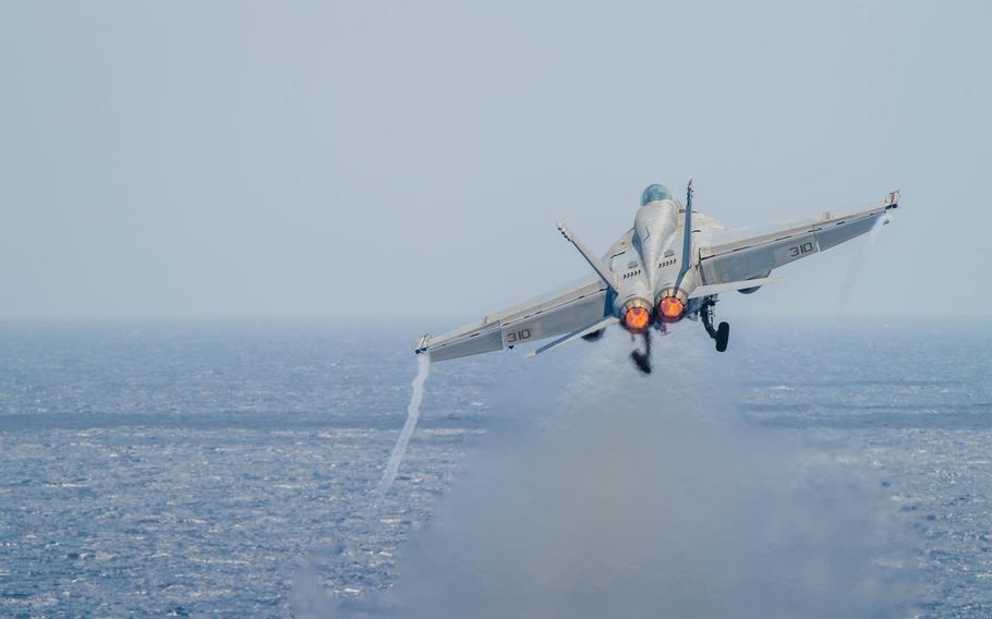 An F/A-18E Super Hornet launches off the flight deck aboard the Nimitz-class aircraft carrier USS Theodore Roosevelt in the South China Sea, March 27, 2024. The United States and three of its Pacific allies planned a military exercise in the South China Sea, a move to demonstrate their rights to navigate and overfly the region freely, according to a statement from all four defense chiefs.