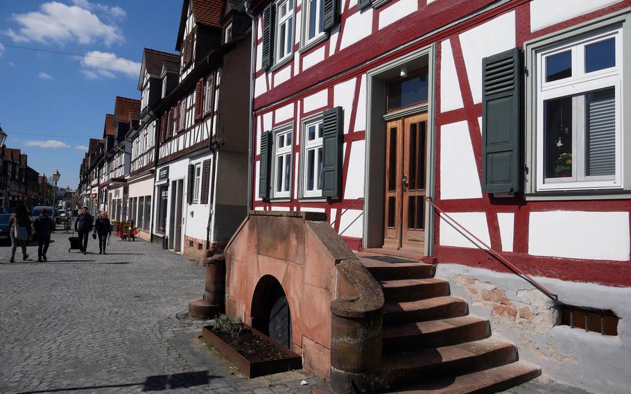 A view down Vorstadt, a half-timbered house-lined street leading west from the Jerusalem Gate in Buedingen, Germany. An edict of tolerance issued in 1712 by Prince Ernst Casimir I permitted religious dissenters to settle in Buedingen. The Vorstadt became a suburb for the settlers.
