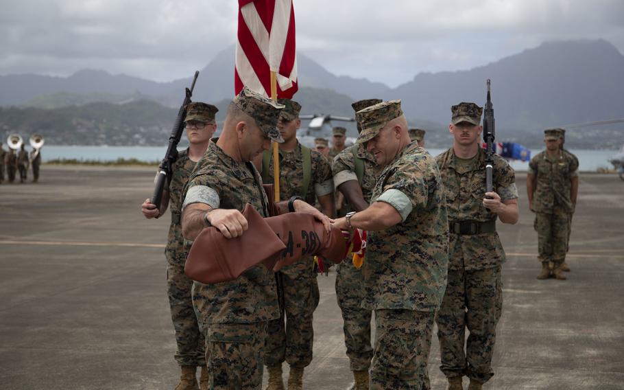 Marines from Marine Light Attack Helicopter Squadron 367 case their unit’s colors during a ceremony at Marine Corps Base Hawaii, Friday, April 22, 2022. 