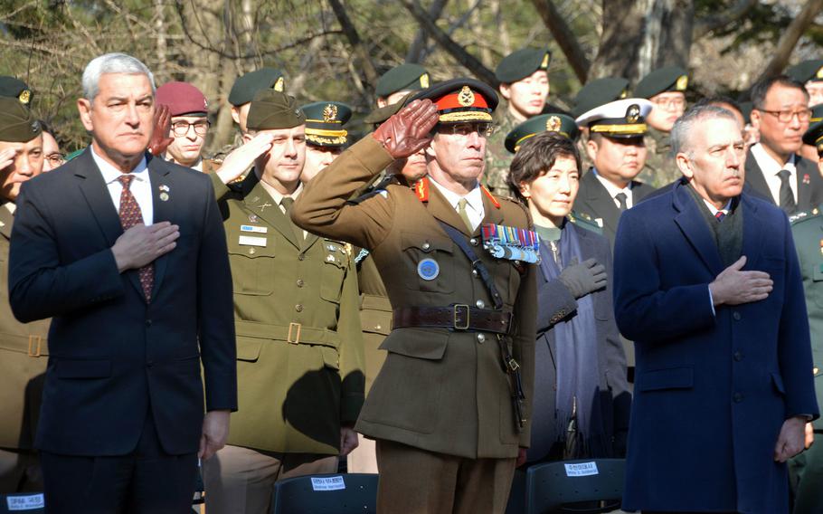 Kelly McKeague, left, director of the Defense POW/MIA Accounting Agency; United Kingdom Lt. Gen. Andrew Harrison, center, deputy commander of United Nations Command; and Philip Goldberg, the U.S. ambassador to South Korea, pay their respects during a repatriation ceremony at Seoul National Cemetery, Wednesday, Feb. 22, 2023.