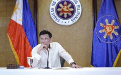 In this photo provided by the Malacanang Presidential Photographers Division, Philippine President Rodrigo Duterte listens during a meeting with government officials at the Malacanang presidential palace in Manila, Philippines on Monday May 23, 2022. Outgoing Philippine President Rodrigo Duterte sharply criticized Russian leader Vladimir Putin for the killings of innocent civilians in Ukraine, saying while the two of them have been tagged as killers, “I kill criminals, I don’t kill children and the elderly.” (King Rodriguez/ Malacanang Presidential Photographers Division via AP)