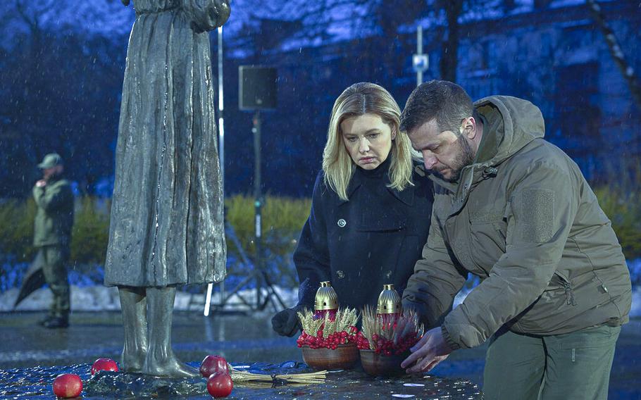 Ukrainian President Volodymyr Zelenskyy and his wife Olena pay tribute in Kyiv, Ukraine, on Saturday, Nov. 26, 2022, at a monument to victims of the Holodomor, Great Famine, which took place in the 1930’s and that killed millions.