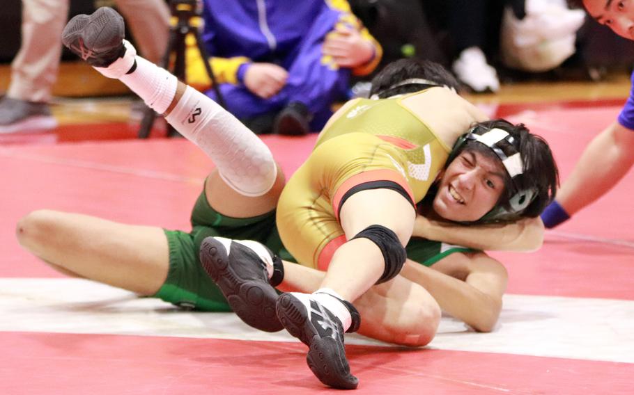 St. Mary's Jong In Lee gains the upper hand on Kubasaki's Jesse Fuentes at 108 pounds.