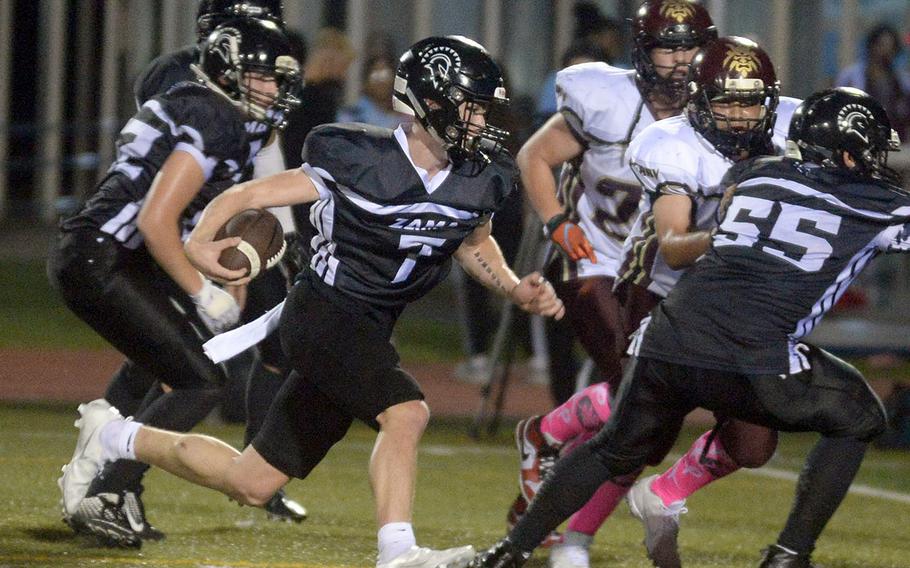 Zama quarterback Dominic Peruccio dashes to the end zone for a 4-yard touchdown run.