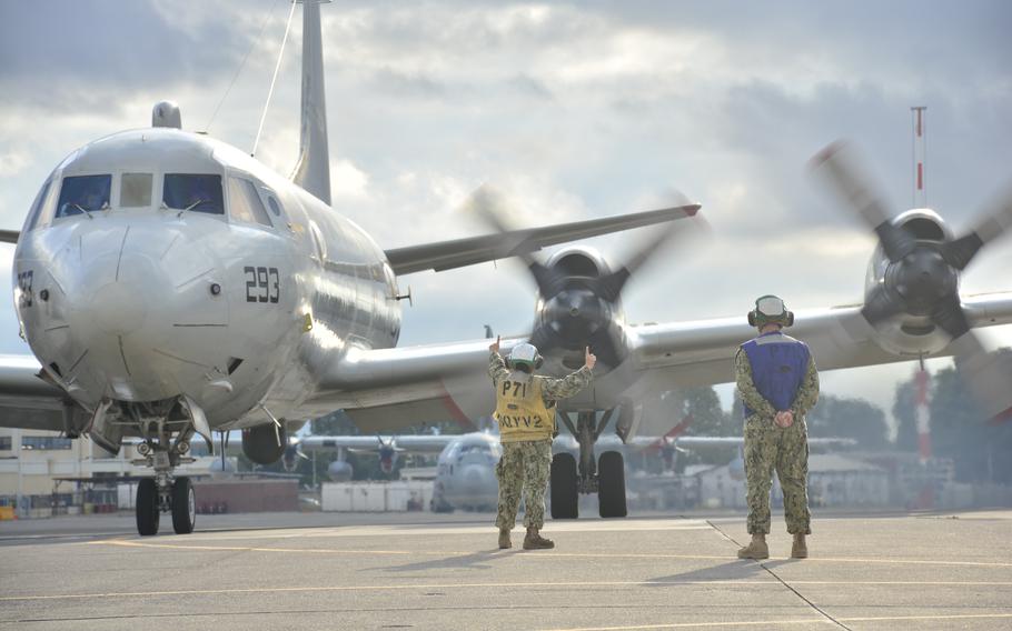 Petty Officer 2nd Class Nana Piccione, left, and Petty Officer 3rd Class Henry Kessler, both assigned to Patrol Squadron 9, launch a P-3C Orion maritime patrol plane at Naval Air Station Sigonella in Sicily in 2015.