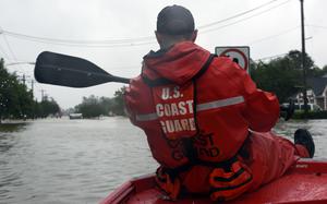 Coast Guard Chief Petty Officer Stephen Kelly helps launch a 16-foot flood punt boat to conduct urban rescues in Friendswood, Texas, Aug. 29, 2017. The flood punt team from Marine Safety Unit Paducah, Kentucky, reported to the greater Houston area on Aug. 25 and have rescued over 850 people. (U.S. Coast Guard photo by Petty Officer 3rd Class Corinne Zilnicki/Released)