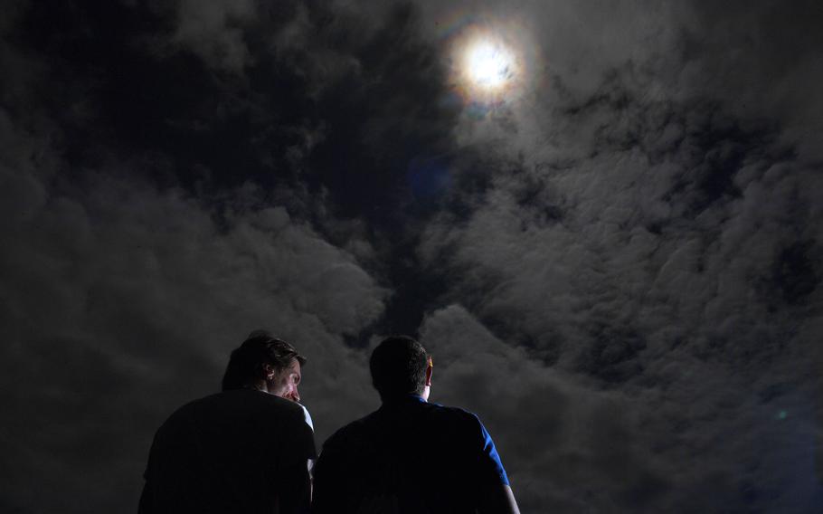 People watch the Aug. 21, 2017, eclipse during a viewing party at the former MUSC Health Stadium in Charleston, S.C. 